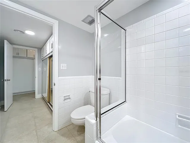 a bathroom with a shower and a toilet