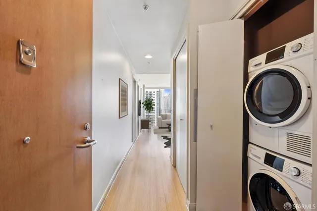 a view of a hallway with washer and dryer