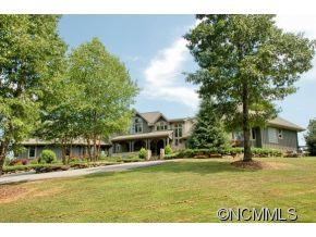 1380 Pkwy N Road Mill Spring, NC 28756 - Photo 1 of 24 a front view of a house with a yard