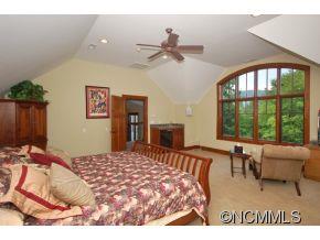 1380 Pkwy N Road Mill Spring, NC 28756 - Photo 12 of 24 a bedroom with a bed and a large window
