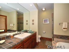 1380 Pkwy N Road Mill Spring, NC 28756 - Photo 15 of 24 a bathroom with a sink and a mirror