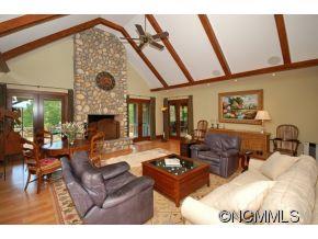 1380 Pkwy N Road Mill Spring, NC 28756 - Photo 4 of 24 a living room with fireplace furniture and a large window