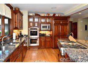 1380 Pkwy N Road Mill Spring, NC 28756 - Photo 6 of 24 a kitchen view with stainless steel appliances granite countertop a stove and a sink