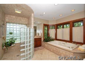 1380 Pkwy N Road Mill Spring, NC 28756 - Photo 10 of 24 a spacious bathroom with a tub and shower