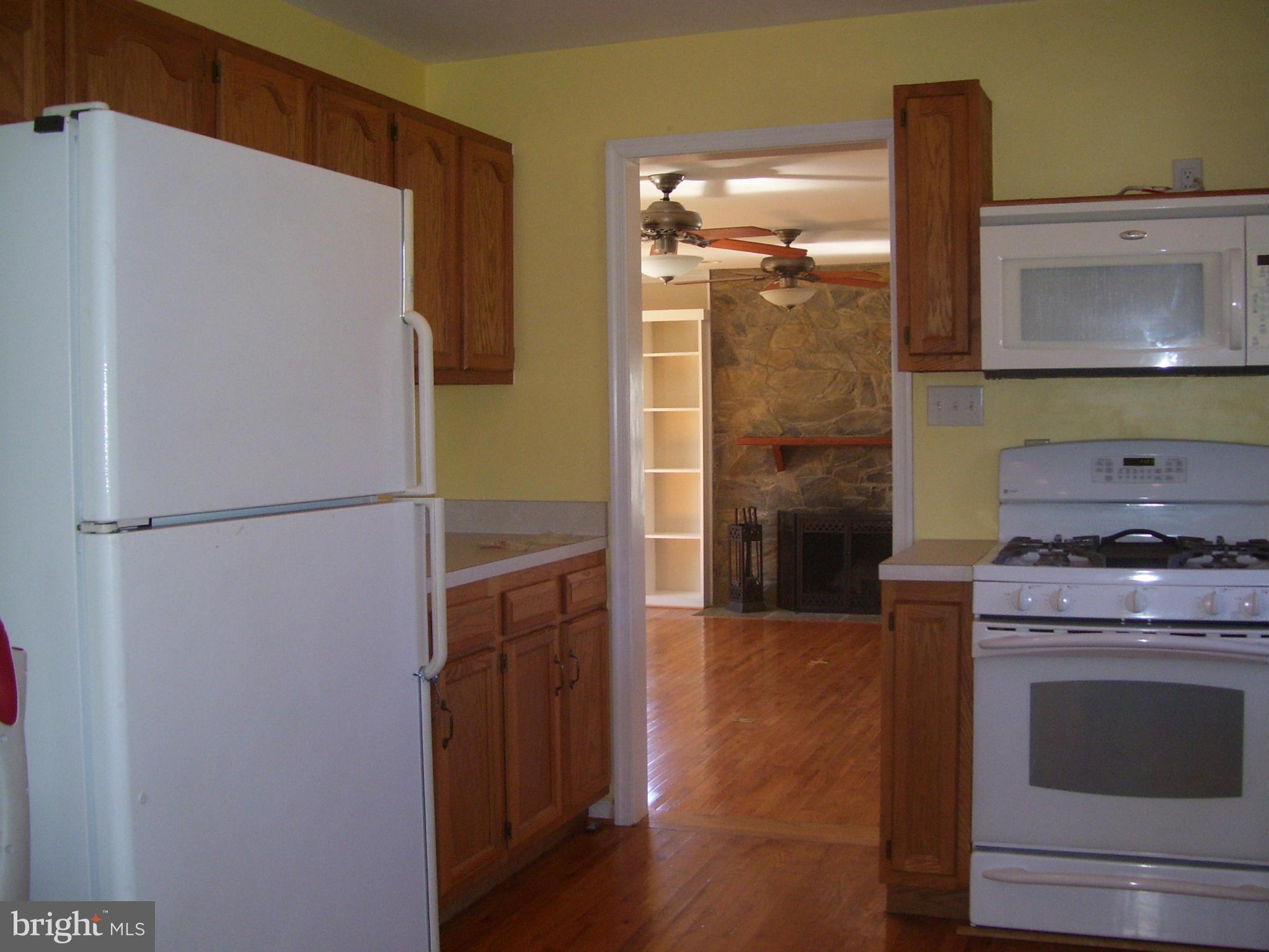3311 Apple Pie Ridge Road Winchester, VA 22603 - Photo 11 of 23 a kitchen with a refrigerator and a stove