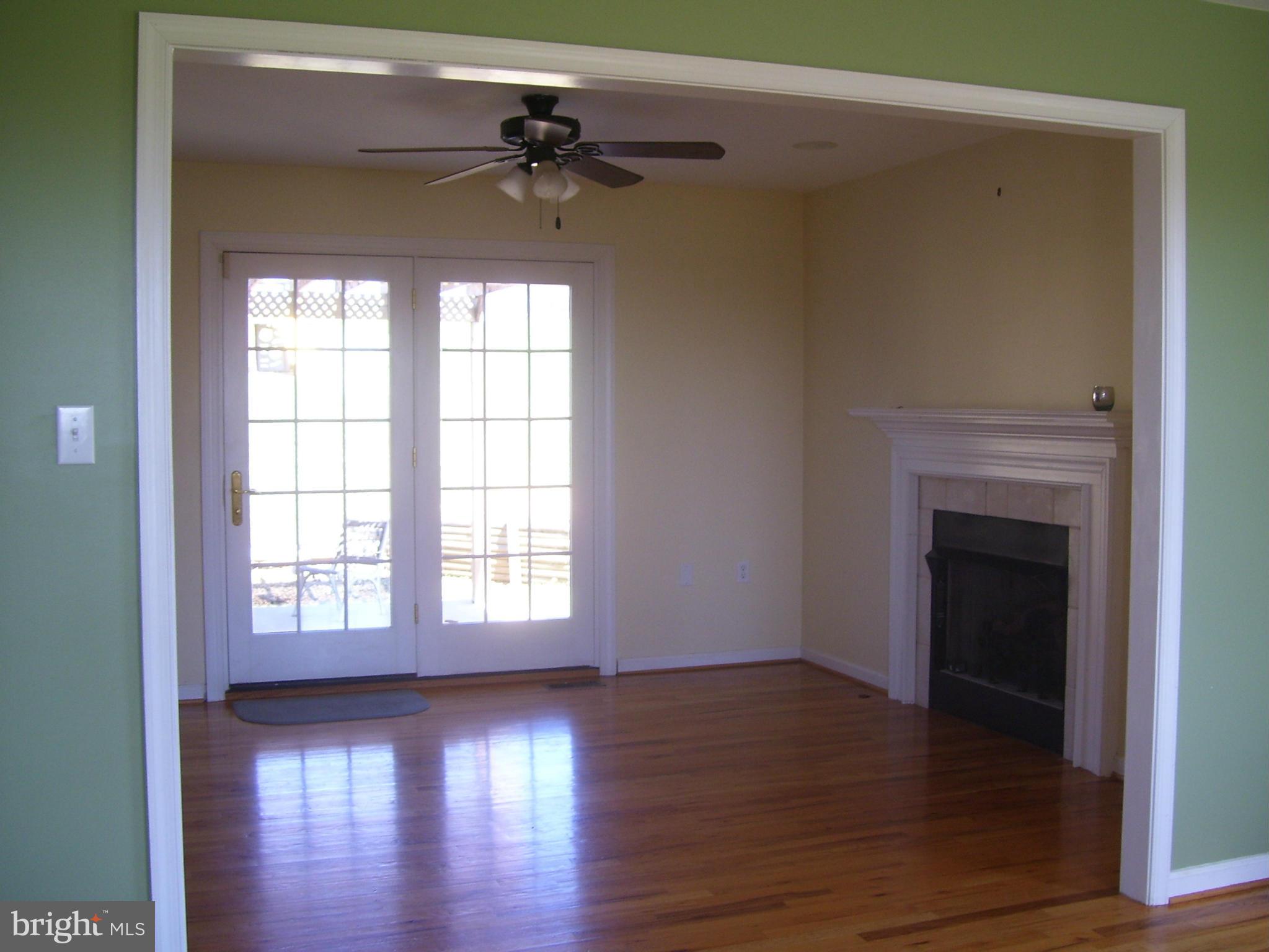 3311 Apple Pie Ridge Road Winchester, VA 22603 - Photo 9 of 23 a view of an empty room with wooden floor and a window