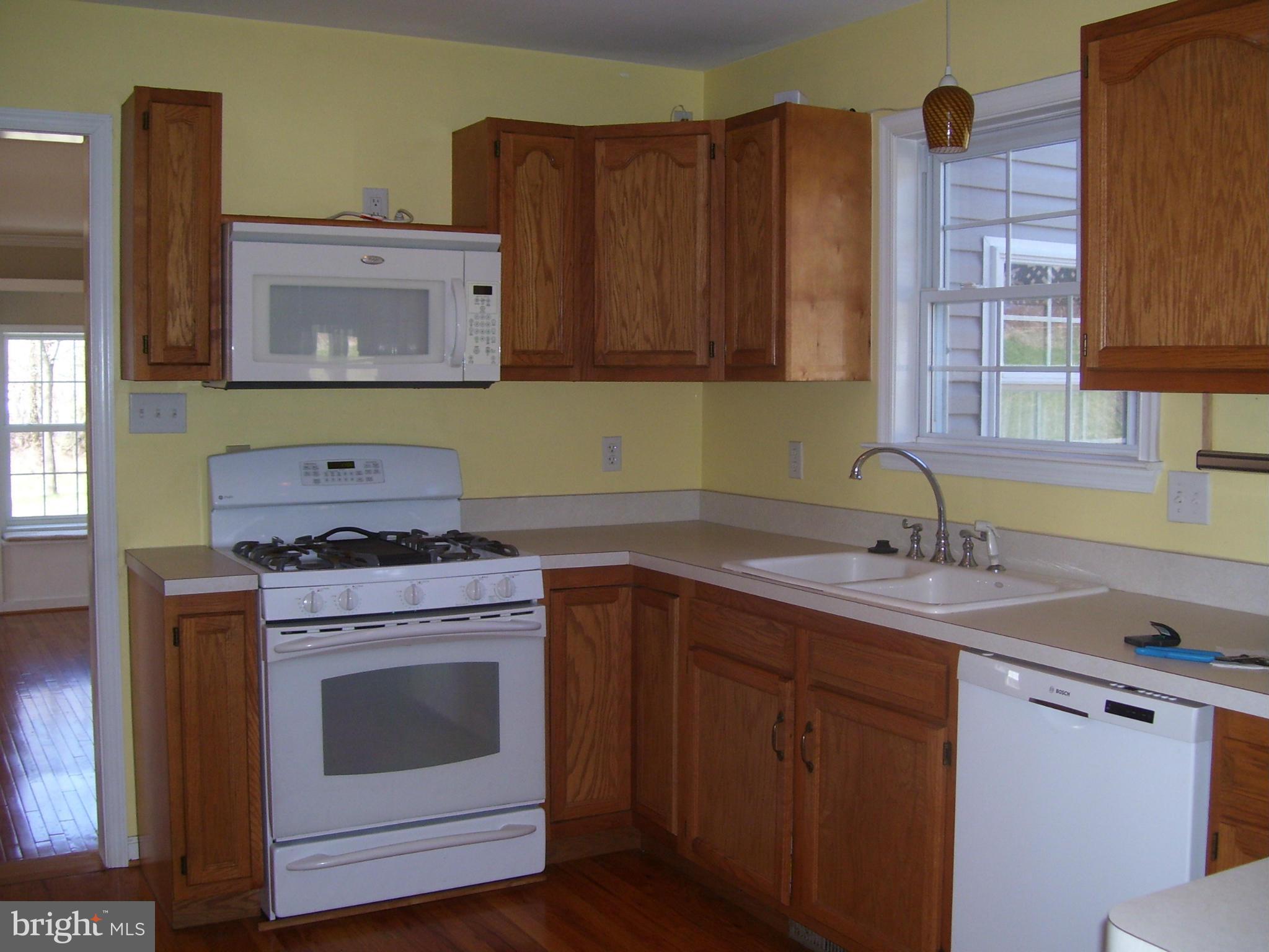 3311 Apple Pie Ridge Road Winchester, VA 22603 - Photo 10 of 23 a kitchen with a stove sink and cabinets
