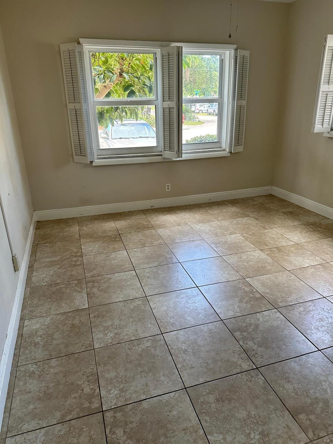 400 North Riverside Drive, Unit 102 Pompano Beach, FL 33062 - Photo 12 of 20 an empty room with a window