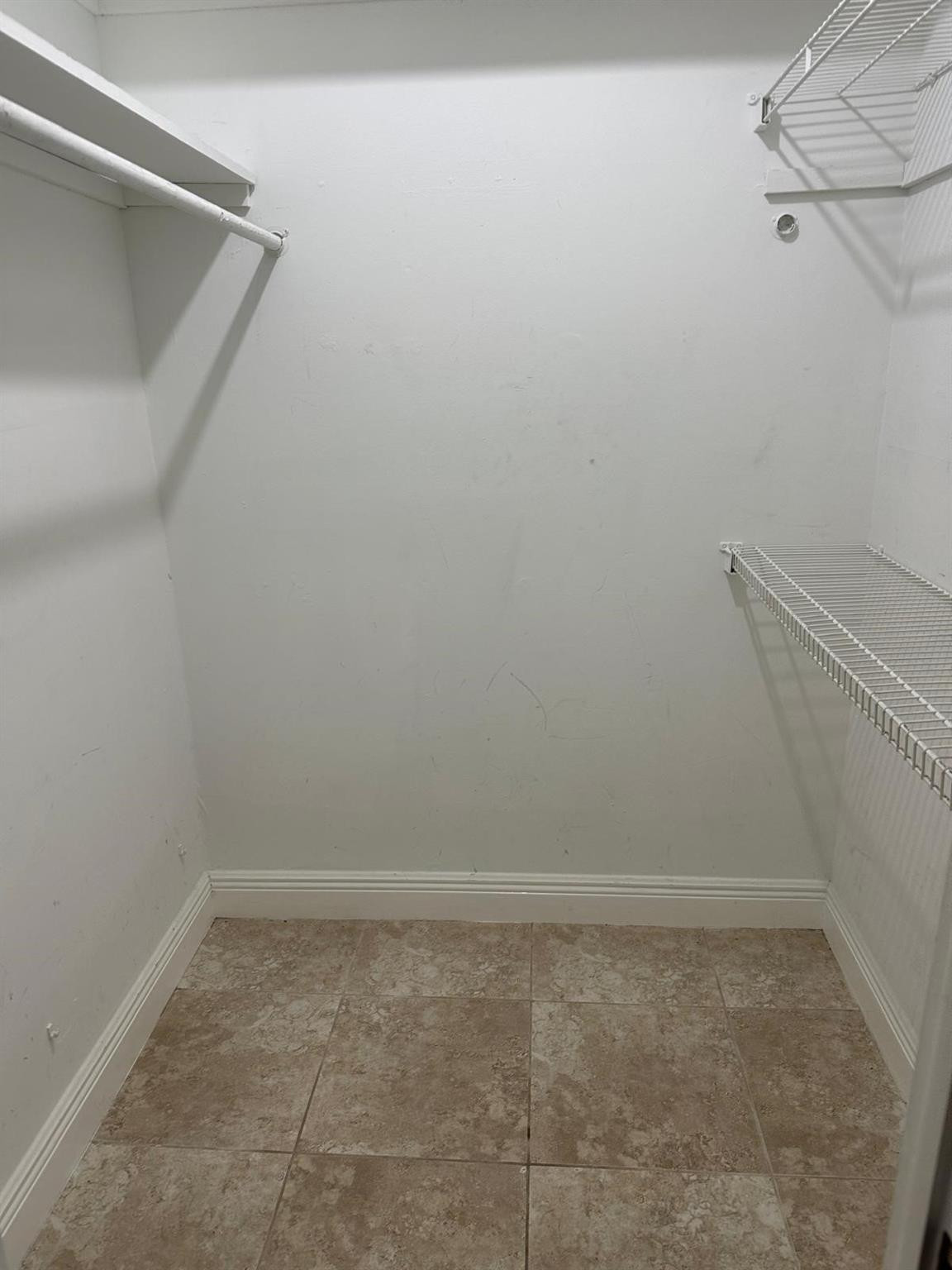 400 North Riverside Drive, Unit 102 Pompano Beach, FL 33062 - Photo 15 of 20 a view of a room with racks on the wall