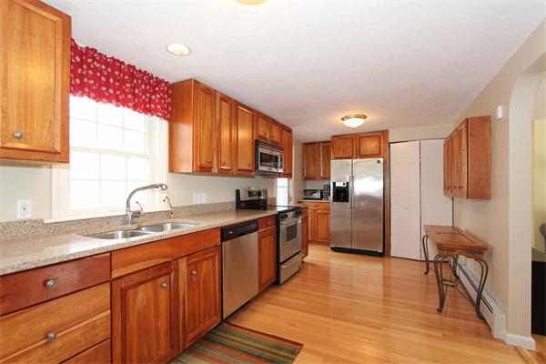 35 Crest Road Natick, MA 01760 - Photo 4 of 19 a kitchen with stainless steel appliances granite countertop a sink refrigerator and cabinets