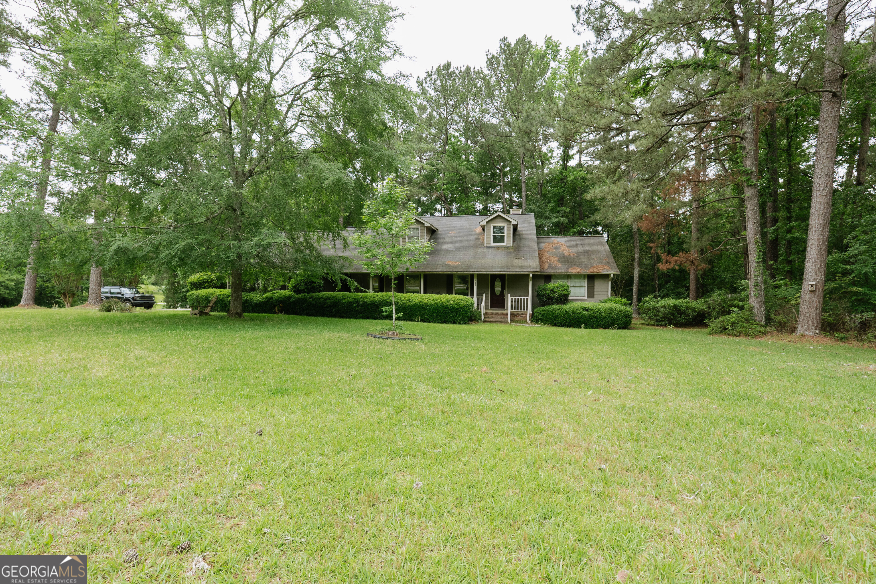 139 Cords Bridge Road Northeast Milledgeville, GA 31061 - Photo 1 of 35 a view of a house with a yard and sitting area