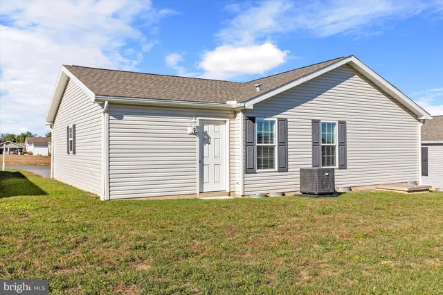 a view of a backyard of the house