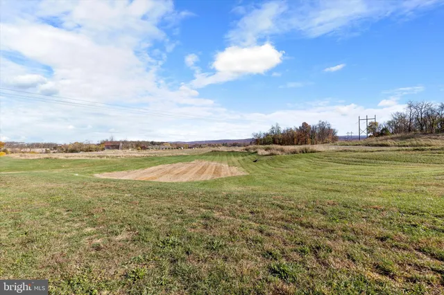 a picture of a bench in front of a wall