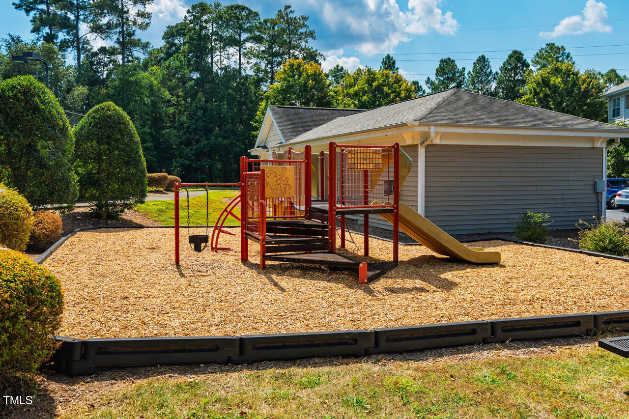 1221 Arborgate Circle, Unit 12 Chapel Hill, NC 27514 - Photo 20 of 20 a view of a small yard with wooden fence