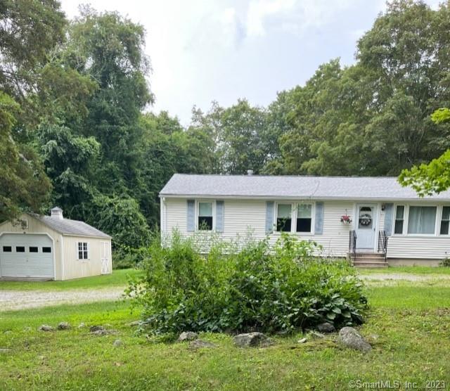 53 Thomaston Road Morris, CT 06763 - Photo 1 of 1 a front view of a house with garden