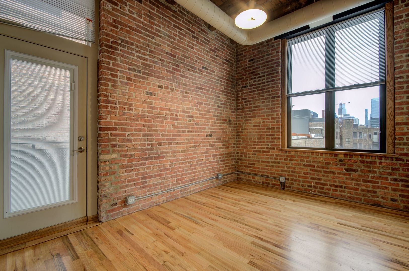 216 North May Street, Unit 303 Chicago, IL 60607 - Photo 12 of 19 a view of an empty room with a window