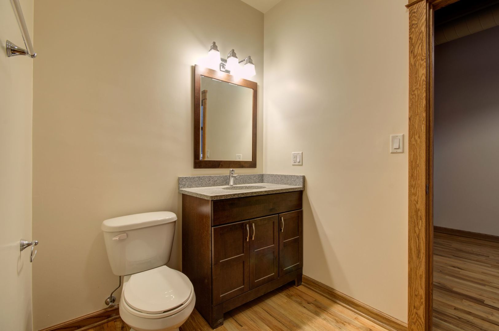 216 North May Street, Unit 303 Chicago, IL 60607 - Photo 15 of 19 a bathroom with a toilet sink and mirror