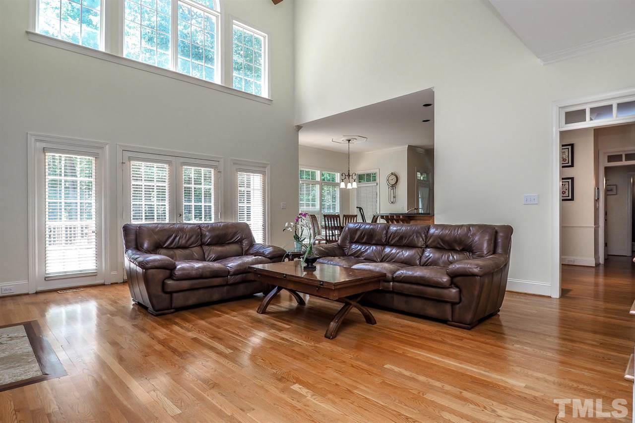 7017 Potomac Court Raleigh, NC 27613 - Photo 5 of 25 a living room with furniture and wooden floor