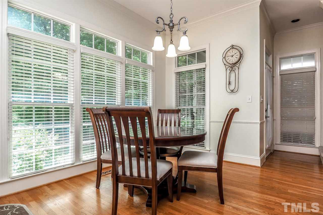 7017 Potomac Court Raleigh, NC 27613 - Photo 9 of 25 a view of a dining room with furniture window and wooden floor