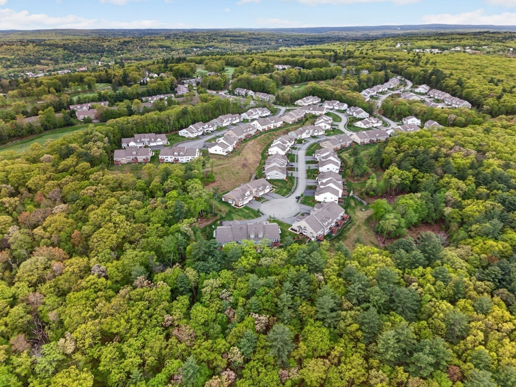 87 Shannon Way, Unit 86 Upton, MA 01568 - Photo 33 of 36 an aerial view of residential houses with outdoor space and trees