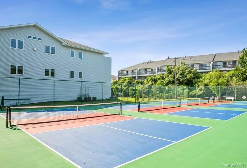 209 Fox Hill Drive Baiting Hollow, NY 11933 - Photo 22 of 28 View of tennis court featuring community basketball court and a residential view