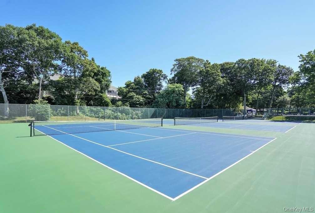 209 Fox Hill Drive Baiting Hollow, NY 11933 - Photo 23 of 28 View of tennis court featuring community basketball court and view of scattered trees