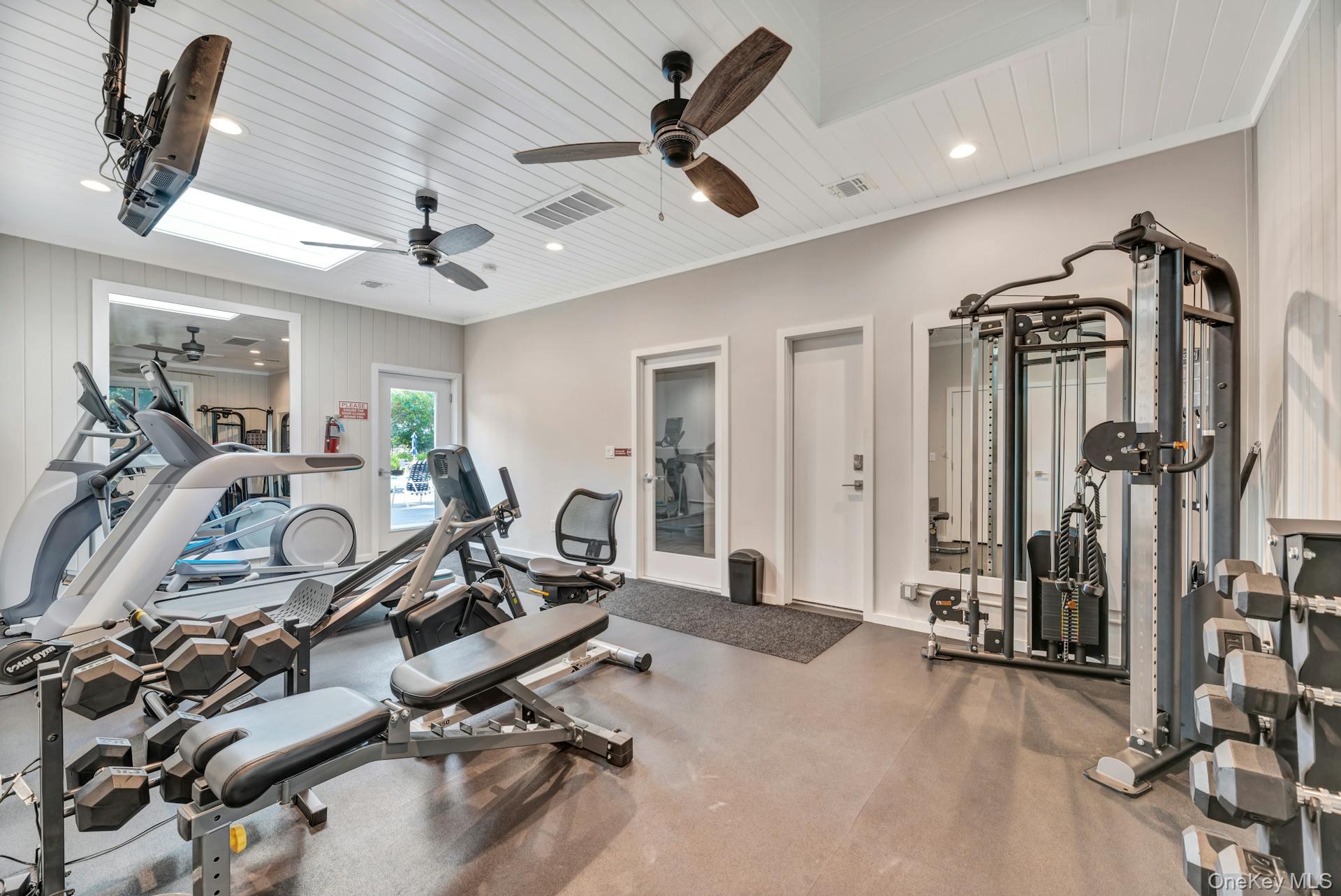 209 Fox Hill Drive Baiting Hollow, NY 11933 - Photo 25 of 28 Exercise area with a skylight, recessed lighting, ornamental molding, and wooden ceiling