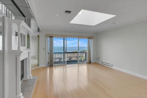 a view of an entryway with wooden floor