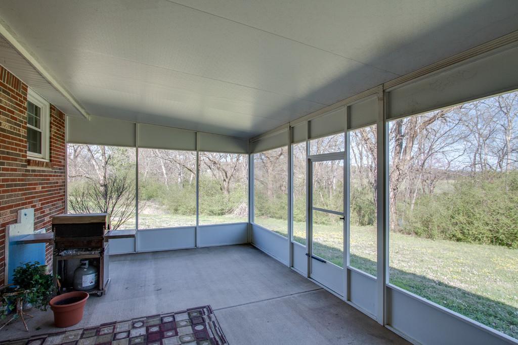 1585 Taylorsville Road Lebanon, TN 37087 - Photo 23 of 28 22X14 Screened porch opens to outside with a short walk to the creek bank
