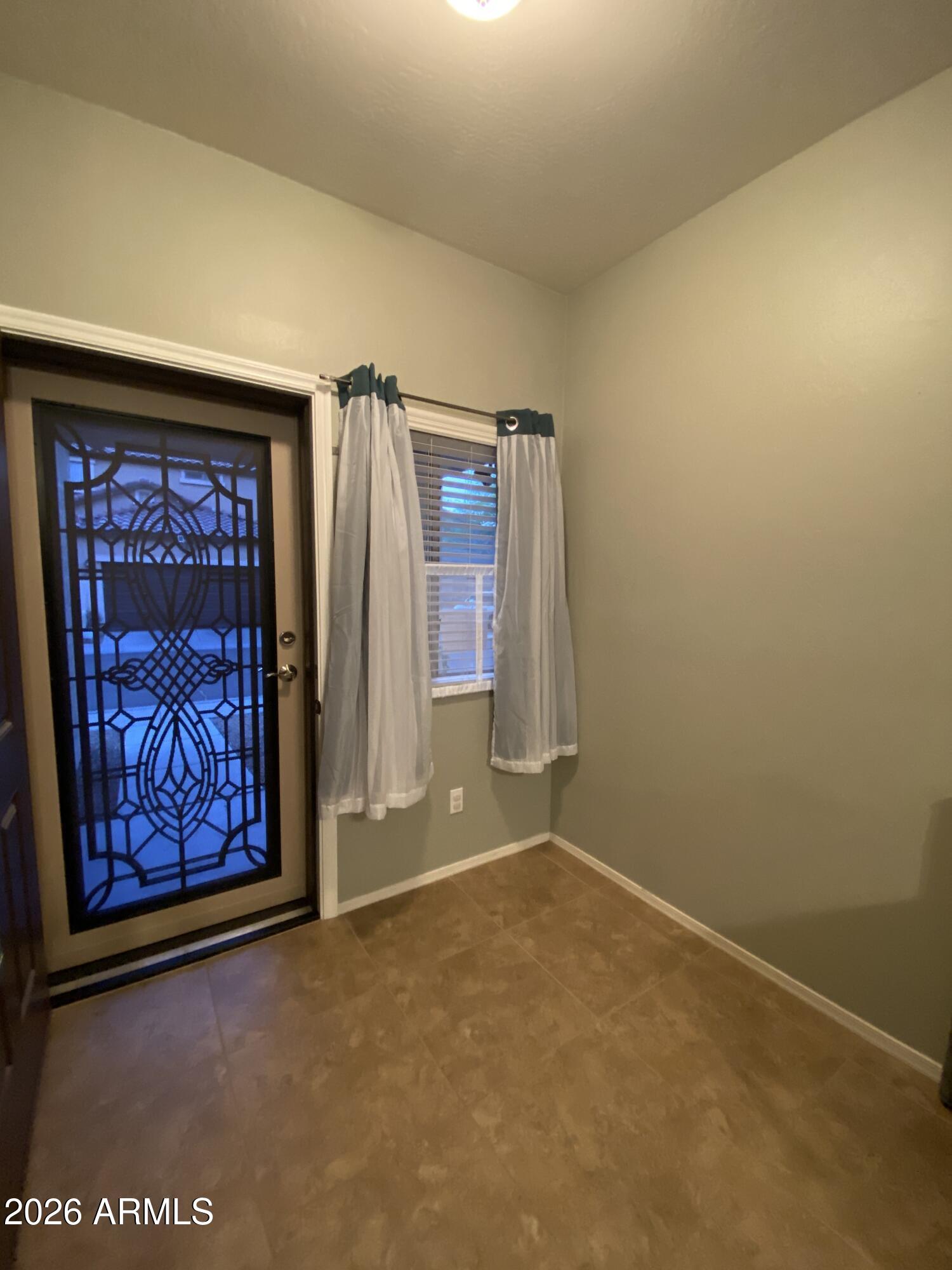 10225 West Camelback Road, Unit 19 Phoenix, AZ 85037 - Photo 3 of 51 an empty room with window
