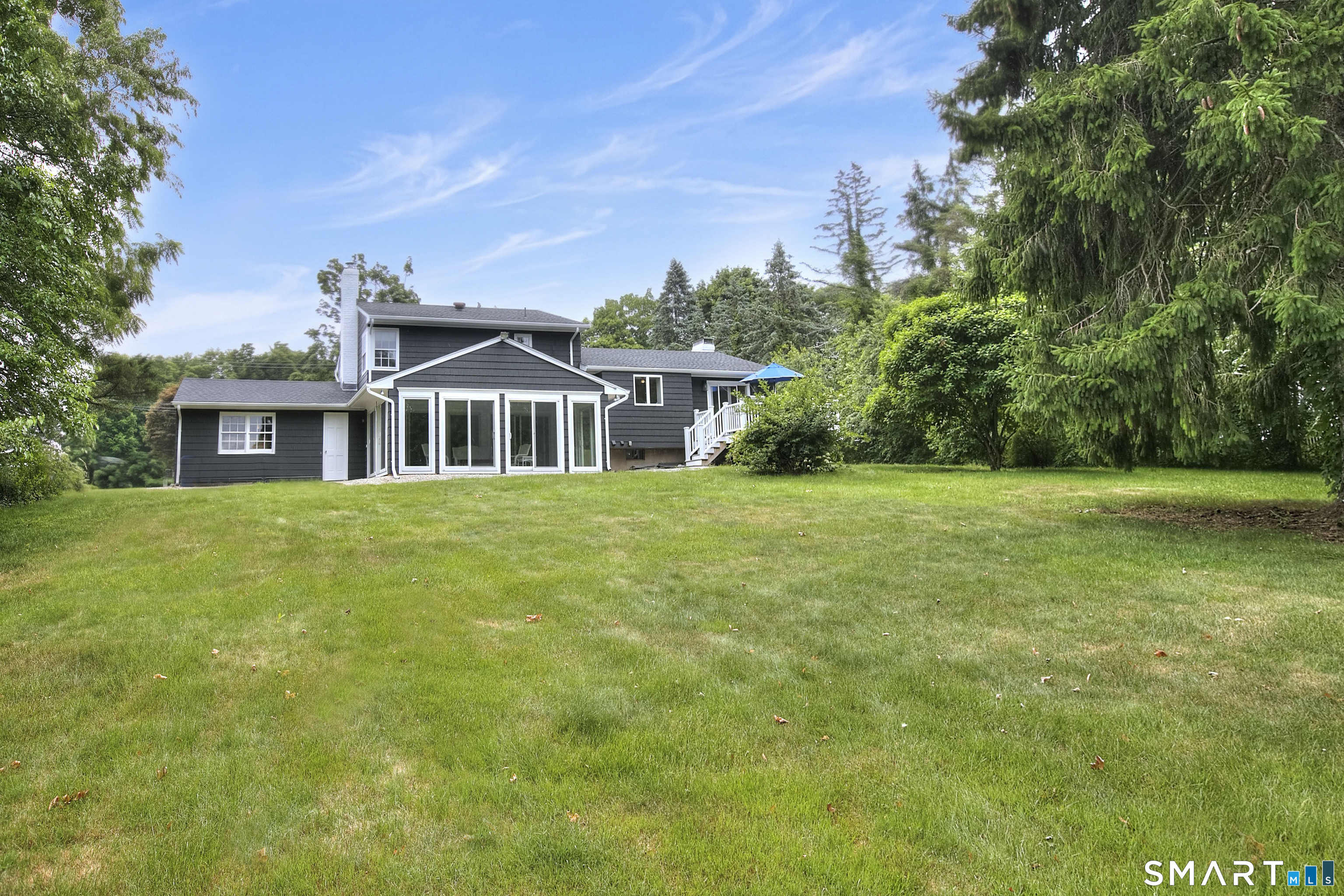 324 Ridge Road Orange, CT 06477 - Photo 33 of 38 a front view of a house with a garden