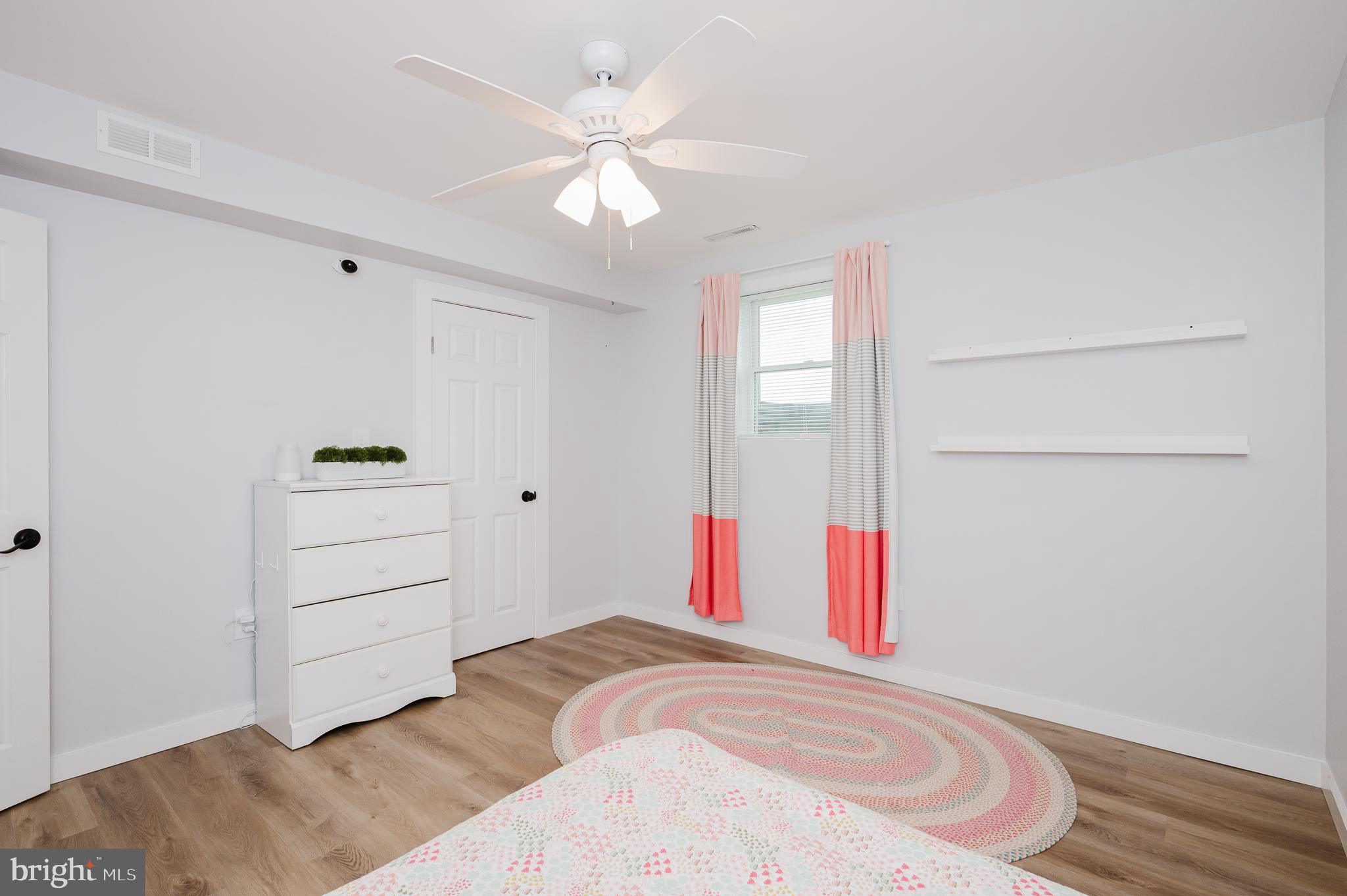 2110 Pleasantville Road Fallston, MD 21047 - Photo 54 of 107 a bedroom with a bed and a chandelier