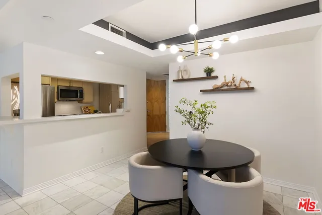 a kitchen with stainless steel appliances a sink a stove and cabinets