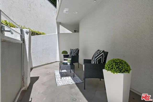 a view of table and chairs in wooden floor