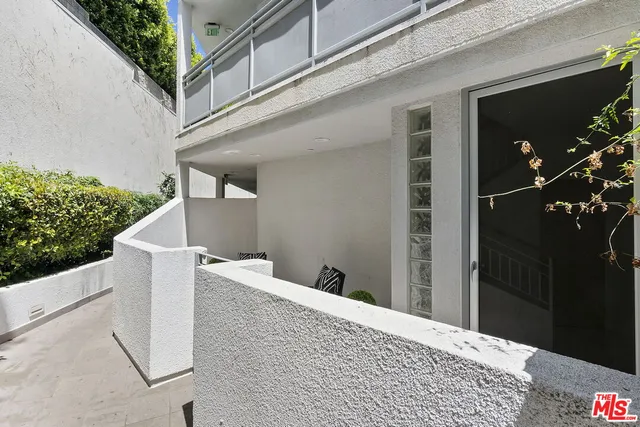 a spacious bedroom with a bed and a table in it