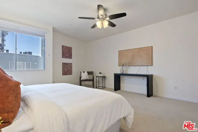 a bedroom with bed and window