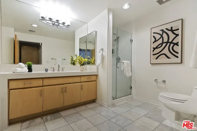 a bathroom with a sink vanity and a mirror