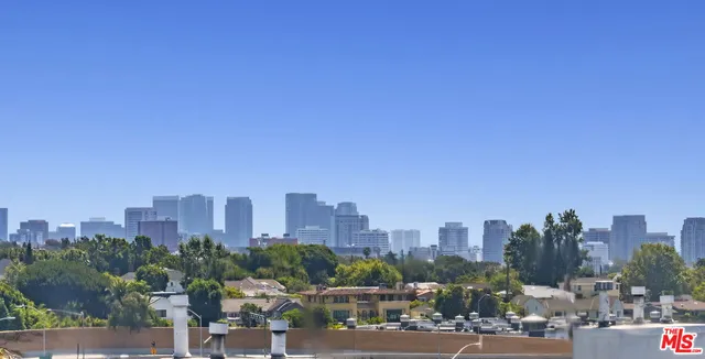 a view of swimming pool with outdoor seating and plants