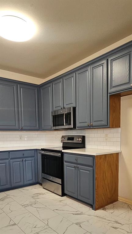 611 Gladness Rhome, TX 76078 - Photo 16 of 40 a kitchen with a sink and cabinets