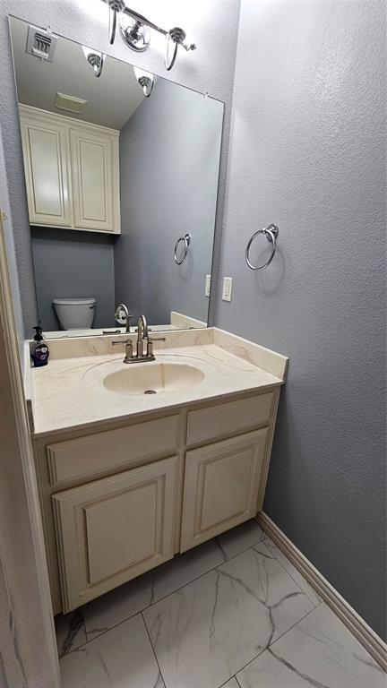 611 Gladness Rhome, TX 76078 - Photo 17 of 40 a bathroom with a sink and a mirror