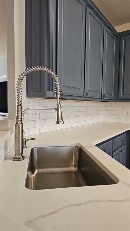611 Gladness Rhome, TX 76078 - Photo 23 of 40 a kitchen with a sink and granite