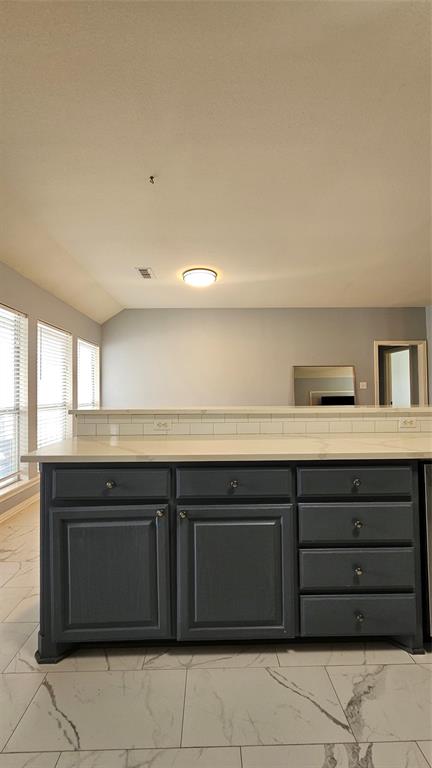 611 Gladness Rhome, TX 76078 - Photo 26 of 40 a kitchen with a sink and cabinets