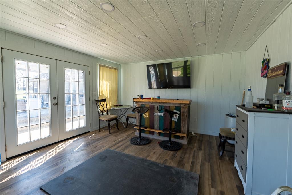 611 Gladness Rhome, TX 76078 - Photo 29 of 40 a view of a workspace with furniture and a window