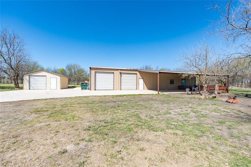 611 Gladness Rhome, TX 76078 - Photo 4 of 40 a front view of a house with a yard