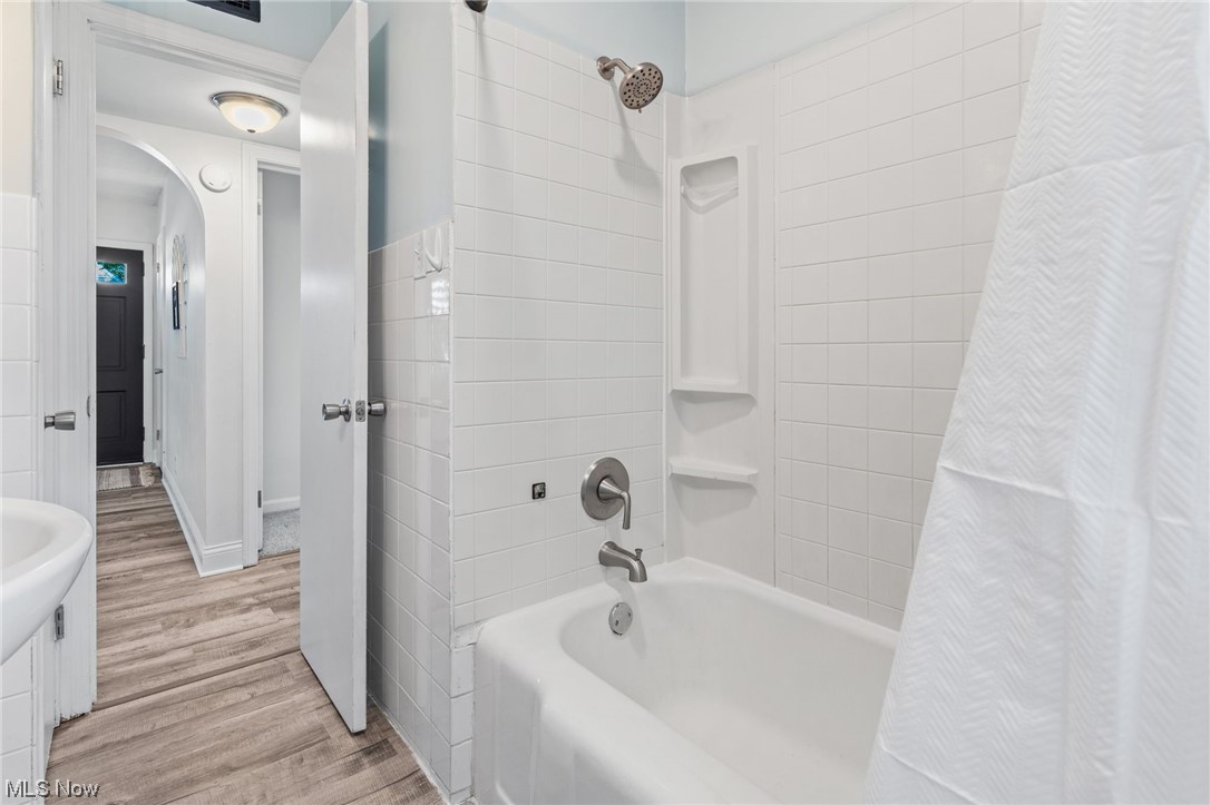 898 Reed Avenue Akron, OH 44306 - Photo 19 of 26 Bathroom featuring light hardwood flooring, shower / tub combo with curtain, and washbasin