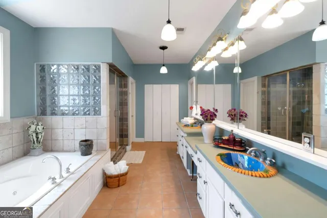 a bedroom with bed and window