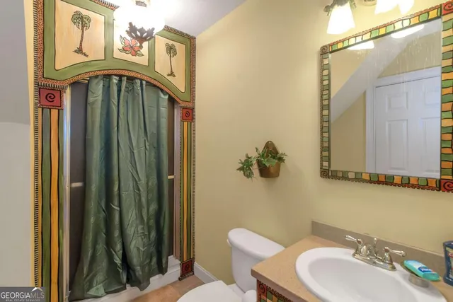 a bathroom with a toilet and a sink