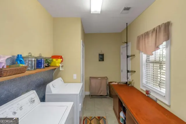 an aerial view of a house with outdoor space