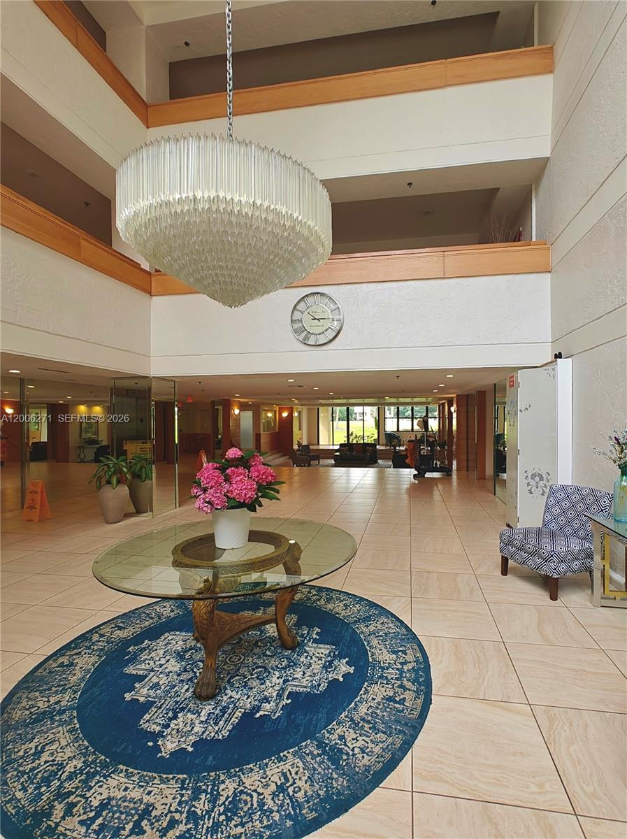 16300 Golf Club Road, Unit 204 Weston, FL 33326 - Photo 13 of 16 a room with lots of tables and chairs