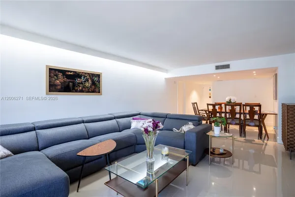 a living room with furniture and a table